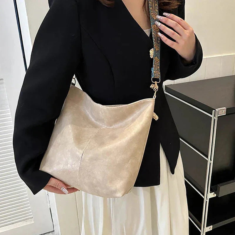 Women's faux-leather hobo bag with bohemian-patterned wide strap