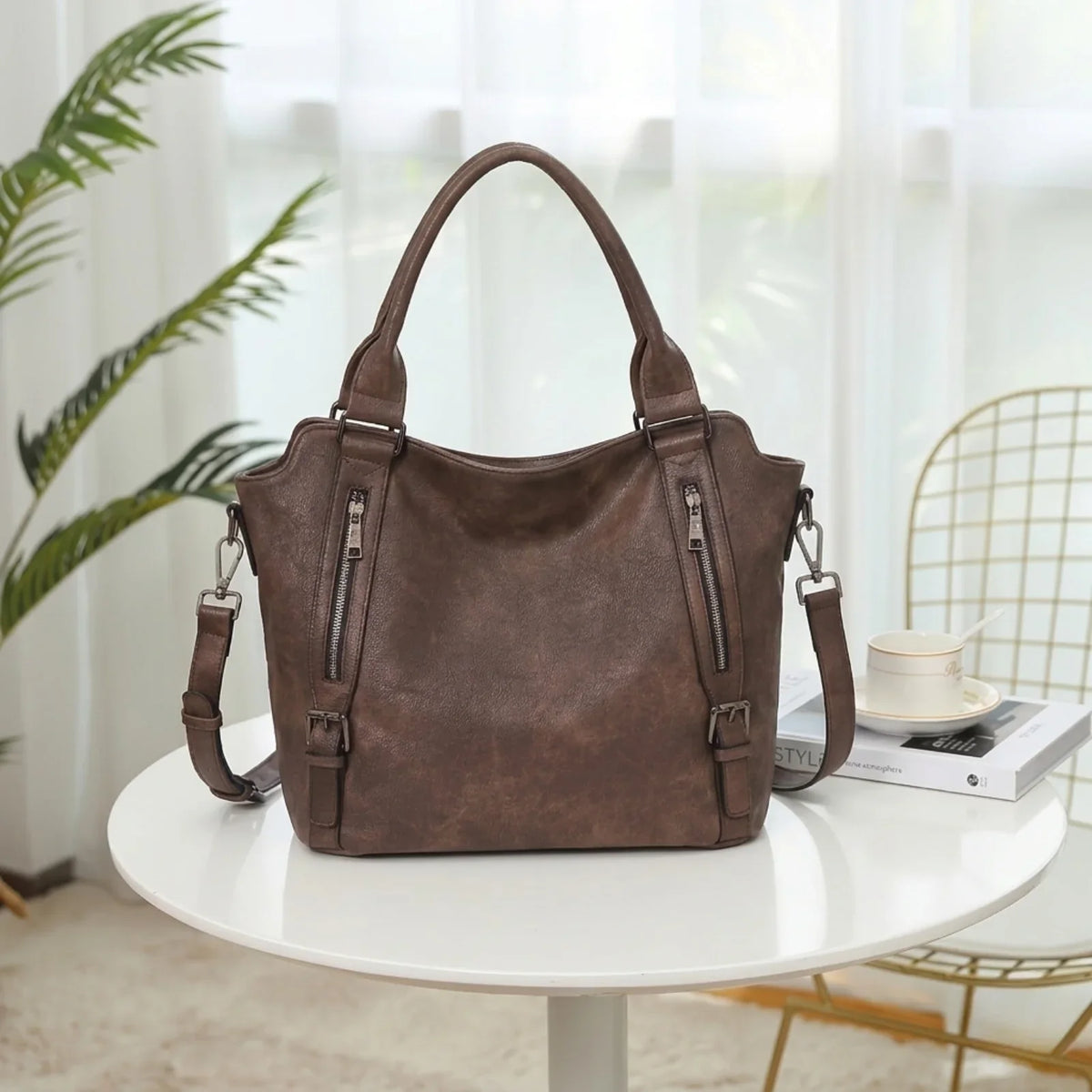 Women's faux leather shoulder tote bag with front zippers and buckles