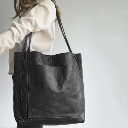 Women's leather tote bag with magnetic snap closure and front patch pocket