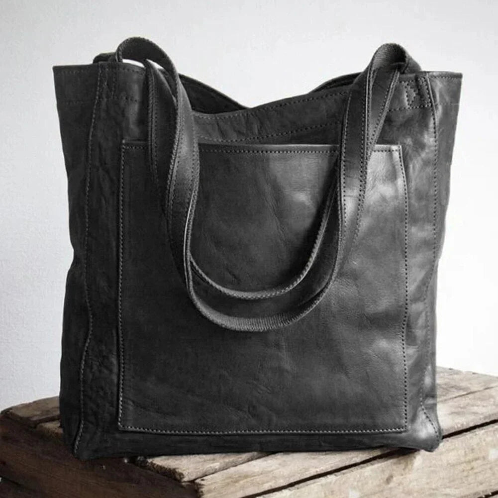 Women's leather tote bag with magnetic snap closure and front patch pocket – Black