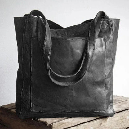 Women's leather tote bag with magnetic snap closure and front patch pocket – Black