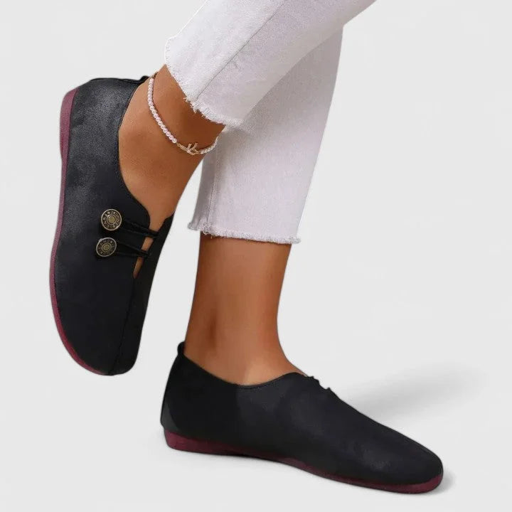 Women's casual distressed slip-on loafers with button-loop detail