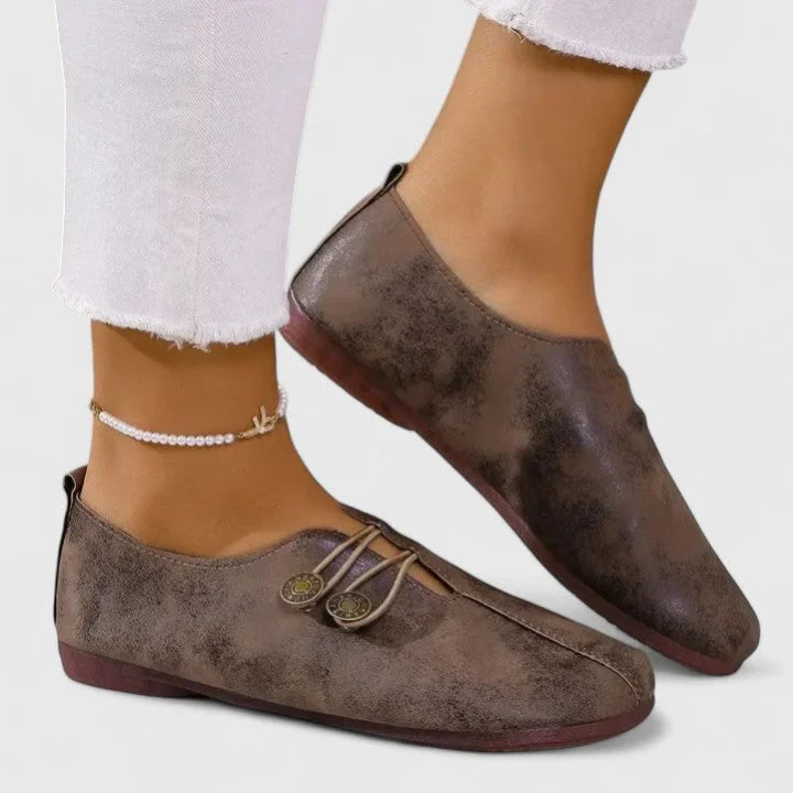 Women's casual distressed slip-on loafers with button-loop detail