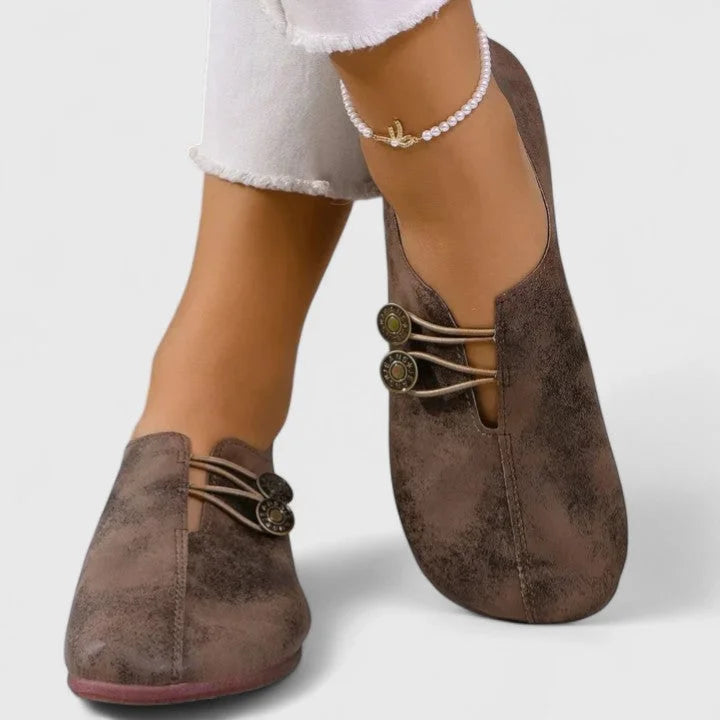 Women's casual distressed slip-on loafers with button-loop detail
