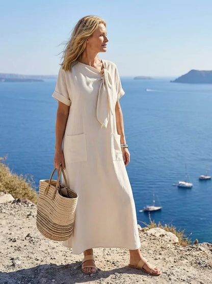 Women's casual maxi dress with tie-neck short sleeves and front pockets
