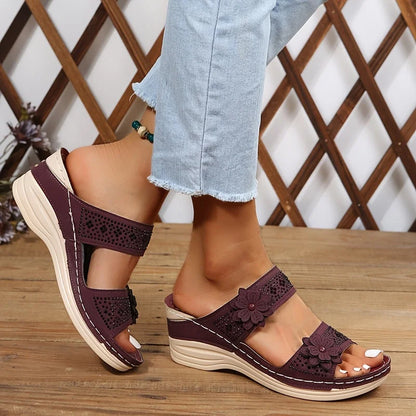 Women's comfort faux suede perforated wedge slides with floral appliqué