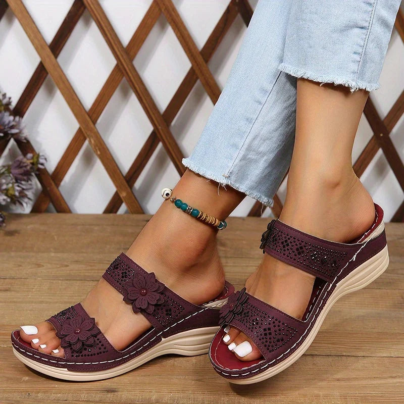 Women's comfort faux suede perforated wedge slides with floral appliqué