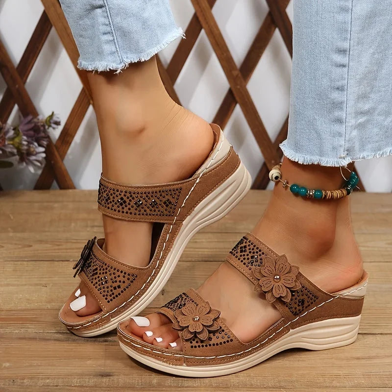 Women's comfort faux suede perforated wedge slides with floral appliqué