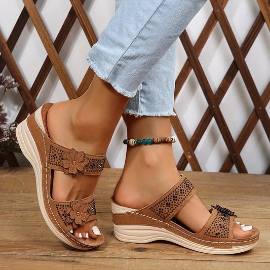 Women's comfort faux suede perforated wedge slides with floral appliqué
