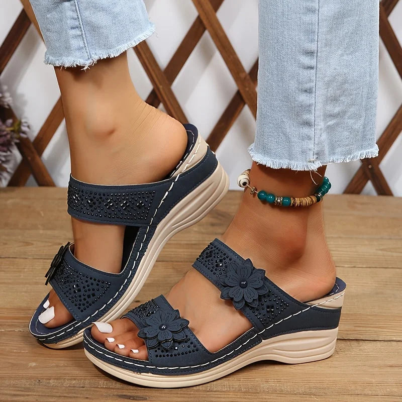 Women's comfort faux suede perforated wedge slides with floral appliqué