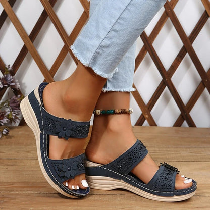 Women's comfort faux suede perforated wedge slides with floral appliqué