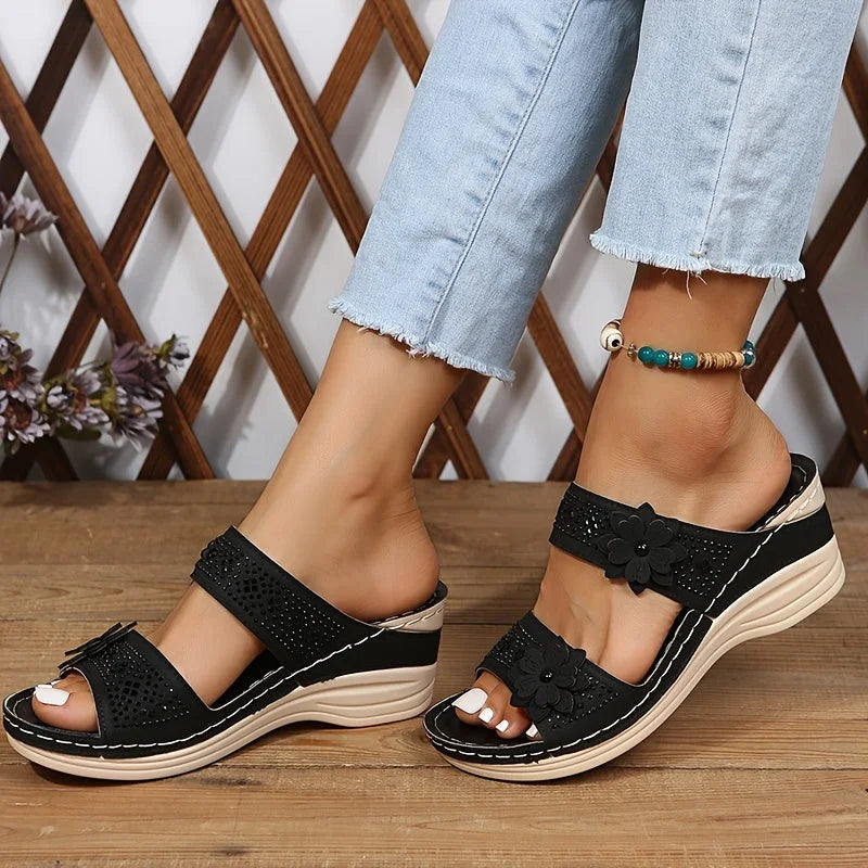 Women's comfort faux suede perforated wedge slides with floral appliqué
