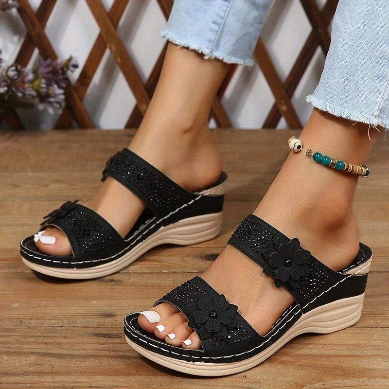 Women's comfort faux suede perforated wedge slides with floral appliqué