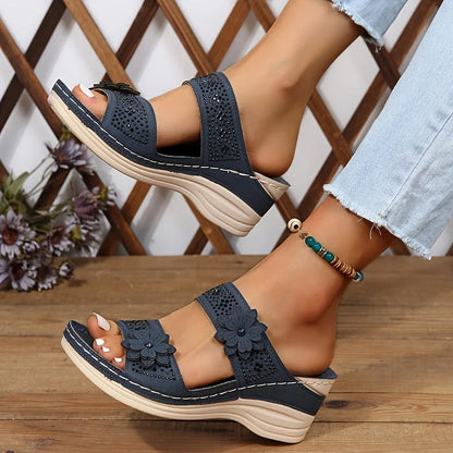 Women's comfort faux suede perforated wedge slides with floral appliqué