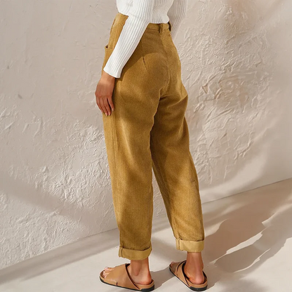 Women's corduroy high-waisted pleated pants with a relaxed tapered fit