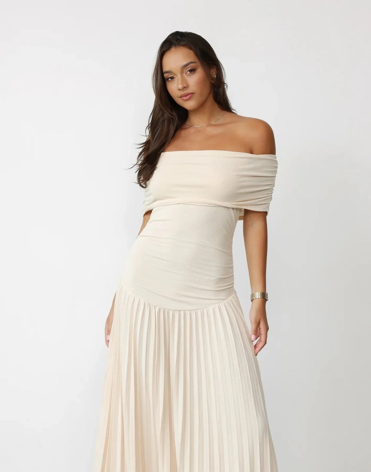Women's flowy summer maxi dress with off-shoulder neckline and pleated skirt