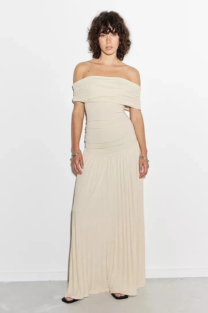 Women's flowy summer maxi dress with off-shoulder neckline and pleated skirt