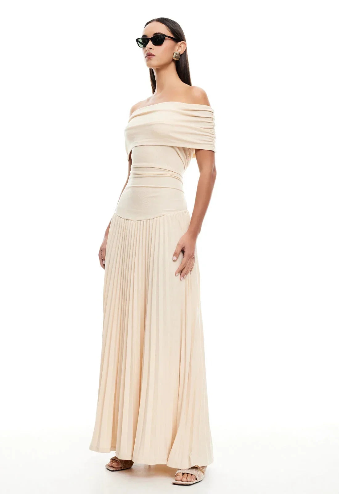 Women's flowy summer maxi dress with off-shoulder neckline and pleated skirt