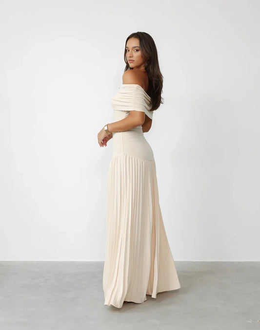 Women's flowy summer maxi dress with off-shoulder neckline and pleated skirt
