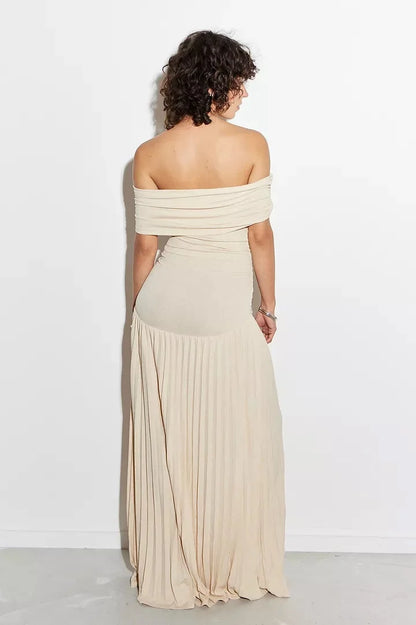 Women's flowy summer maxi dress with off-shoulder neckline and pleated skirt