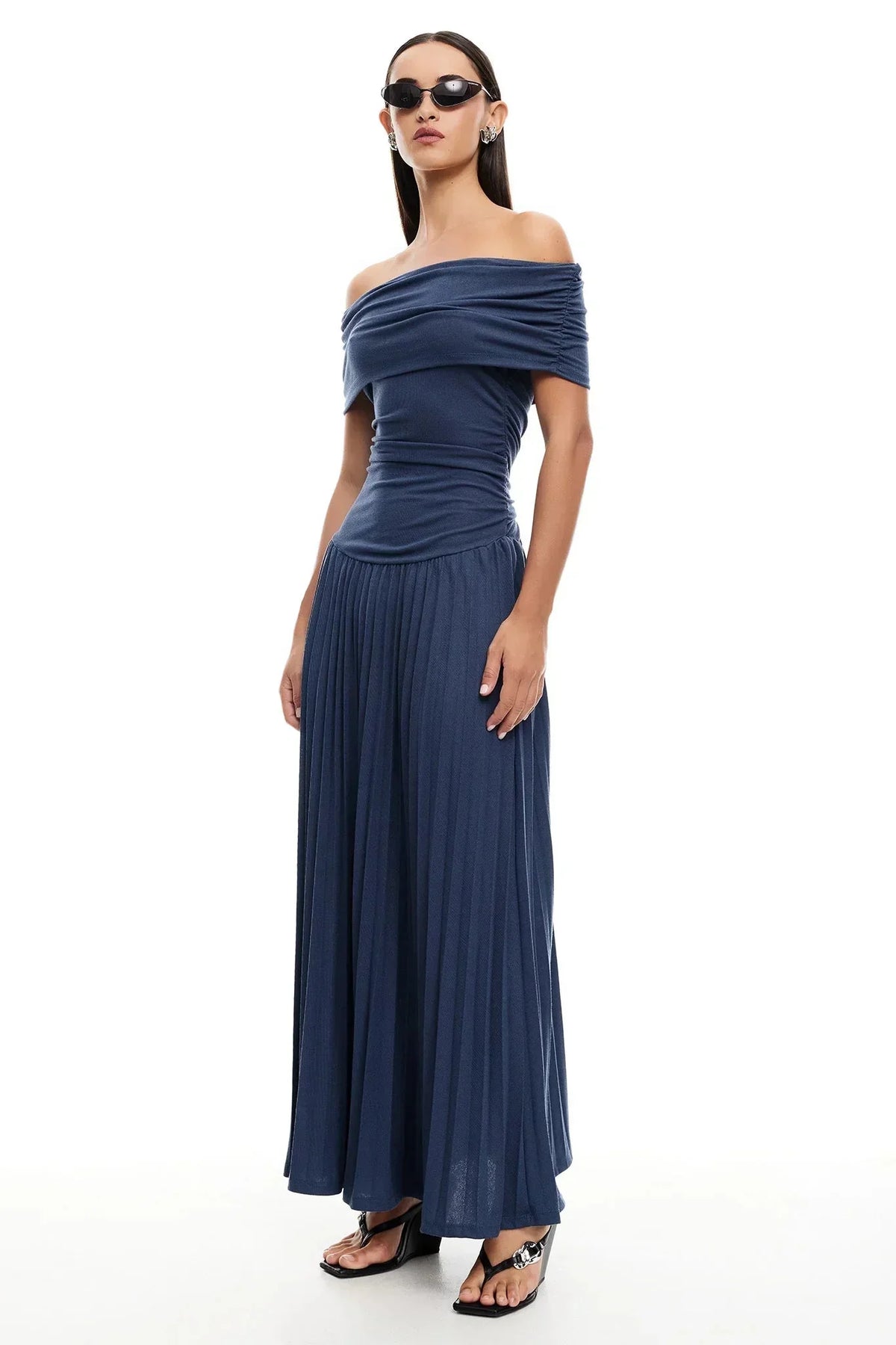 Women's flowy summer maxi dress with off-shoulder neckline and pleated skirt