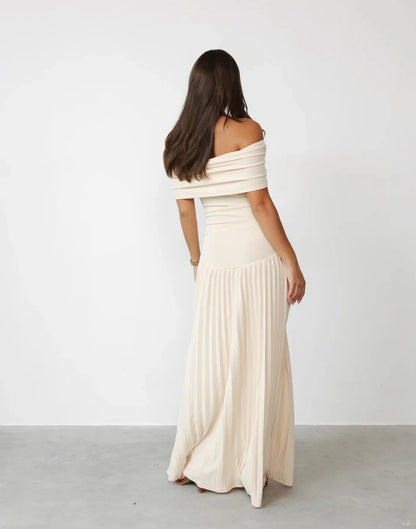 Women's flowy summer maxi dress with off-shoulder neckline and pleated skirt