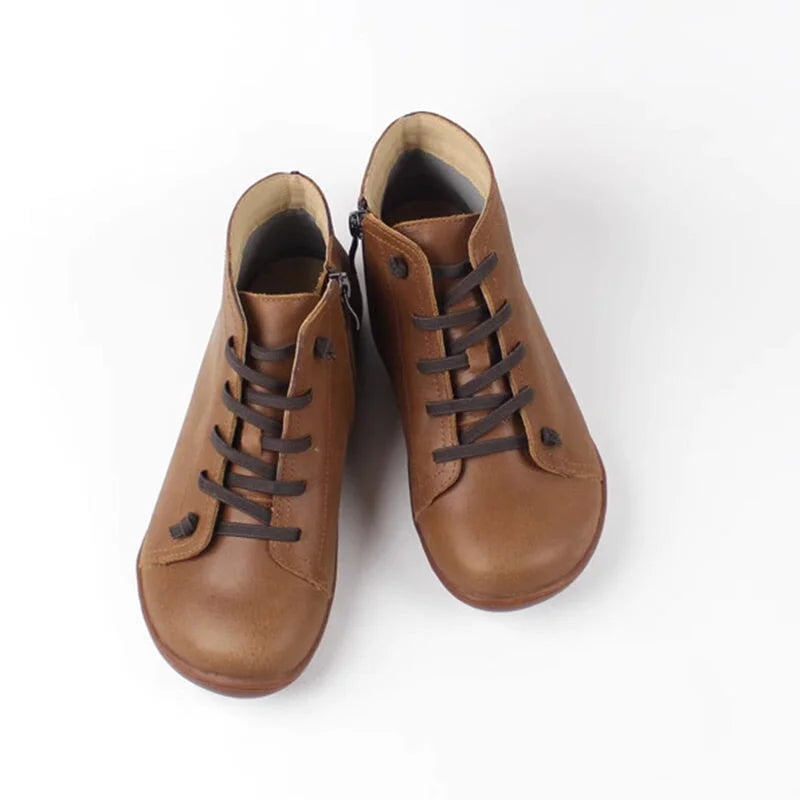 Women's distressed leather ankle boots with side zipper and lace-up front