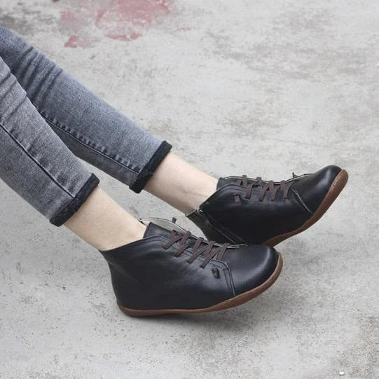 Women's distressed leather ankle boots with side zipper and lace-up front