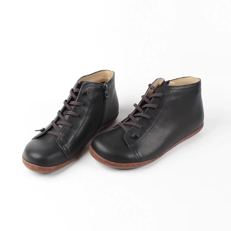 Women's distressed leather ankle boots with side zipper and lace-up front