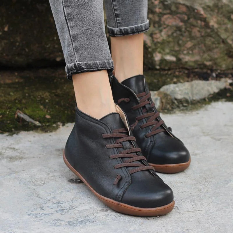 Women's distressed leather ankle boots with side zipper and lace-up front