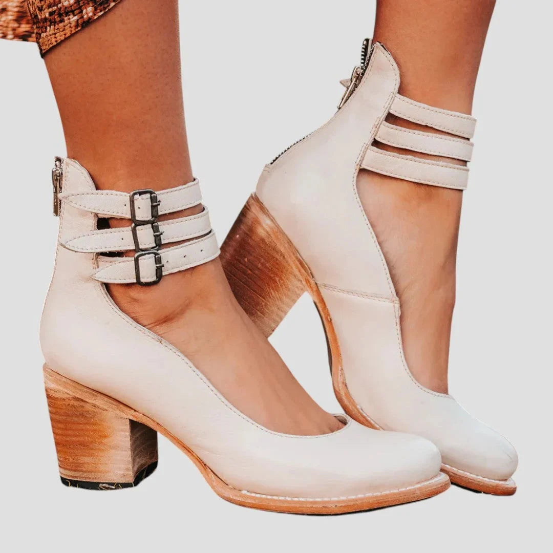 Women's distressed leather cut-out boots with triple-buckle ankle straps – White