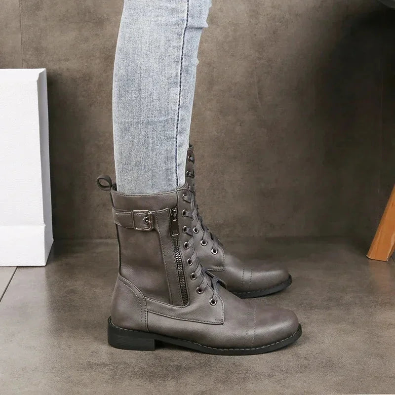 Women's faux leather combat boots with lace-up, side zipper and buckle detail