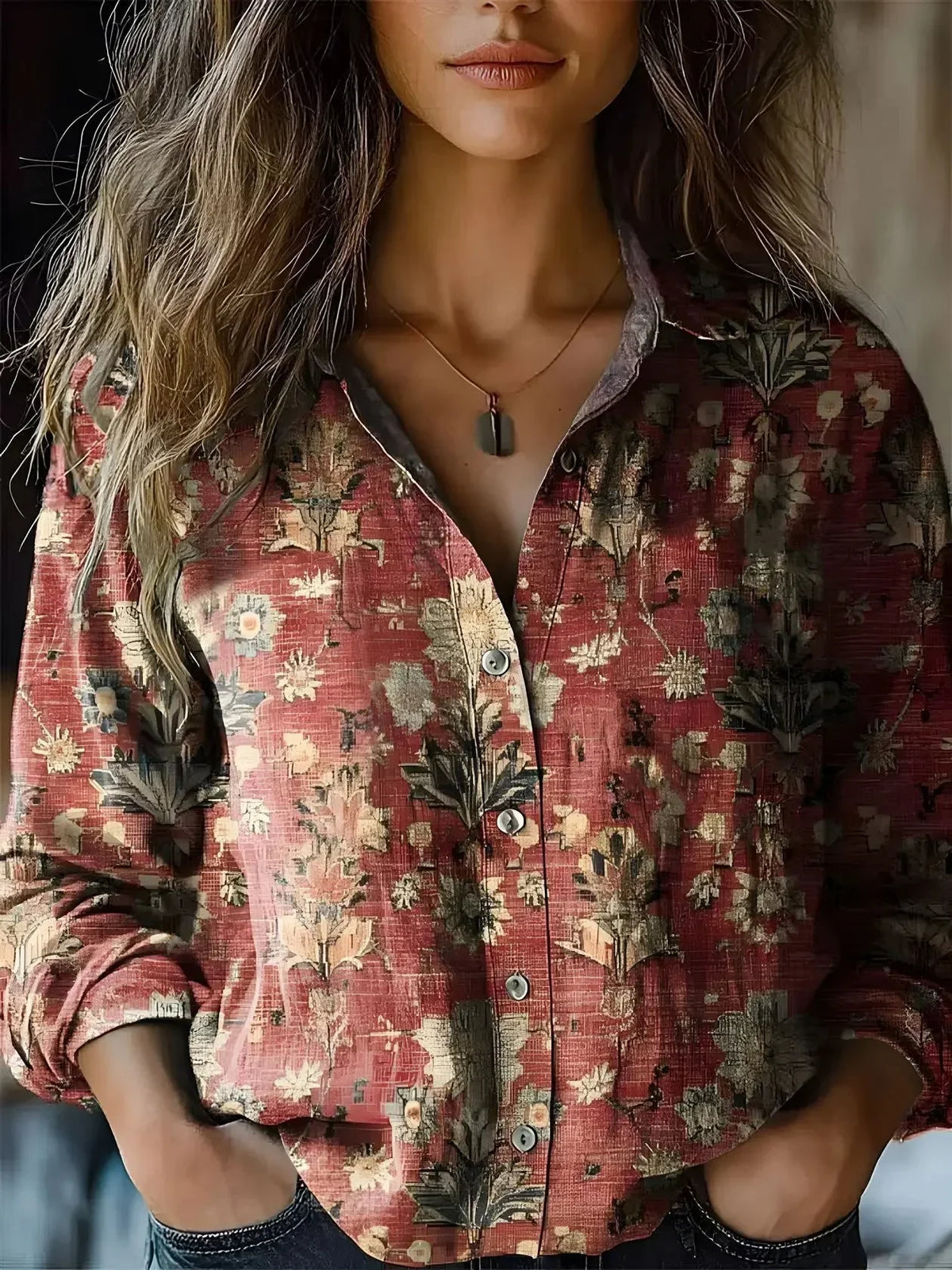 Women's floral collared button-down shirt with long sleeves and chest pockets
