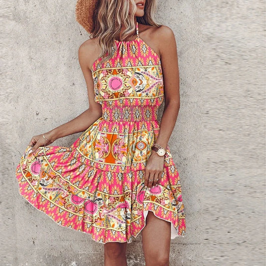 Women's floral-patterned flowy mini dress with halter neckline and smocked waist – Pink
