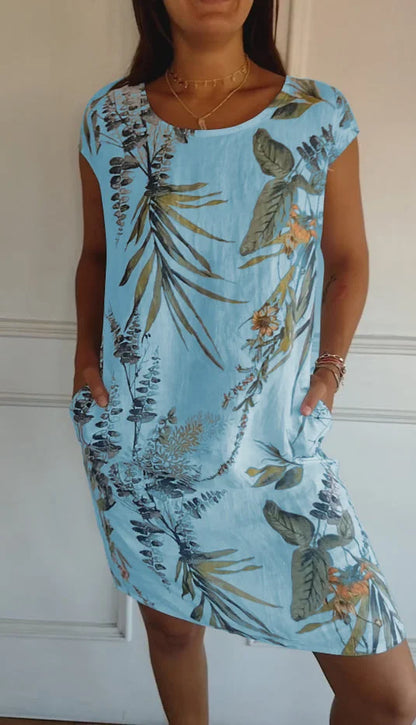 Women's floral print mini dress with round-neck short sleeves and side pockets – Light Blue