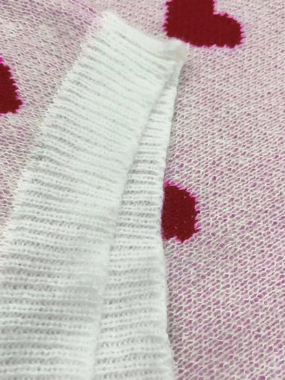 Women's heart print long-sleeve knit sweater with crew neck and ribbed cuffs