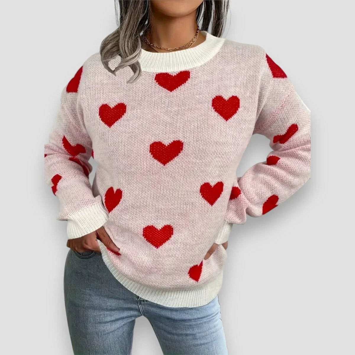 Women's heart print long-sleeve knit sweater with crew neck and ribbed cuffs