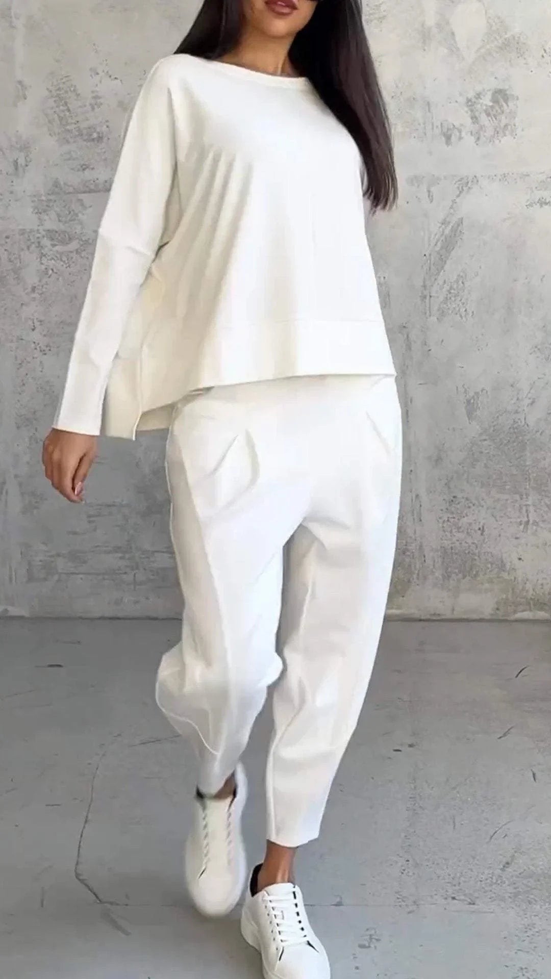 Women's knit 2-piece lounge set with long sleeve boat-neck top and tapered pants with pockets