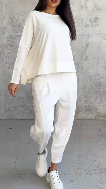 Women's knit 2-piece lounge set with long sleeve boat-neck top and tapered pants with pockets