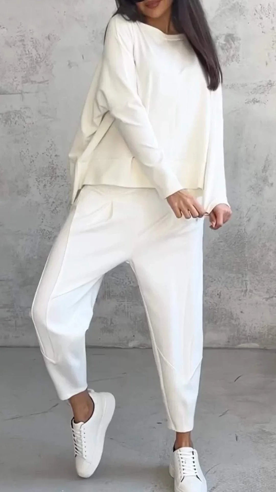 Women's knit 2-piece lounge set with long sleeve boat-neck top and tapered pants with pockets