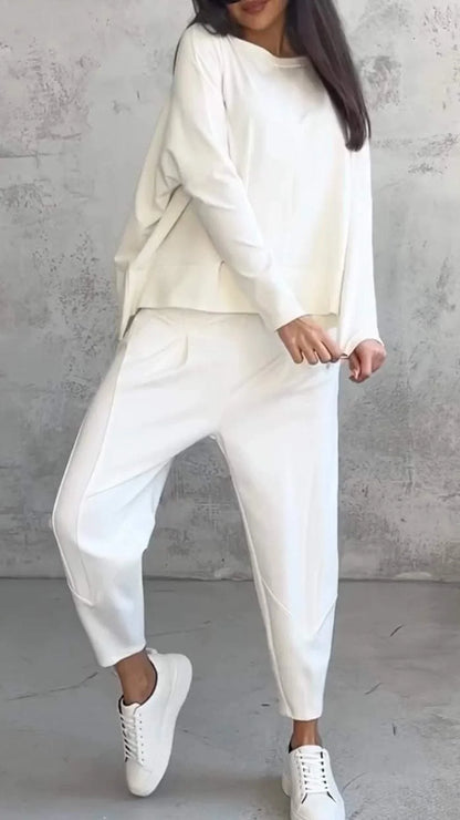 Women's knit 2-piece lounge set with long sleeve boat-neck top and tapered pants with pockets