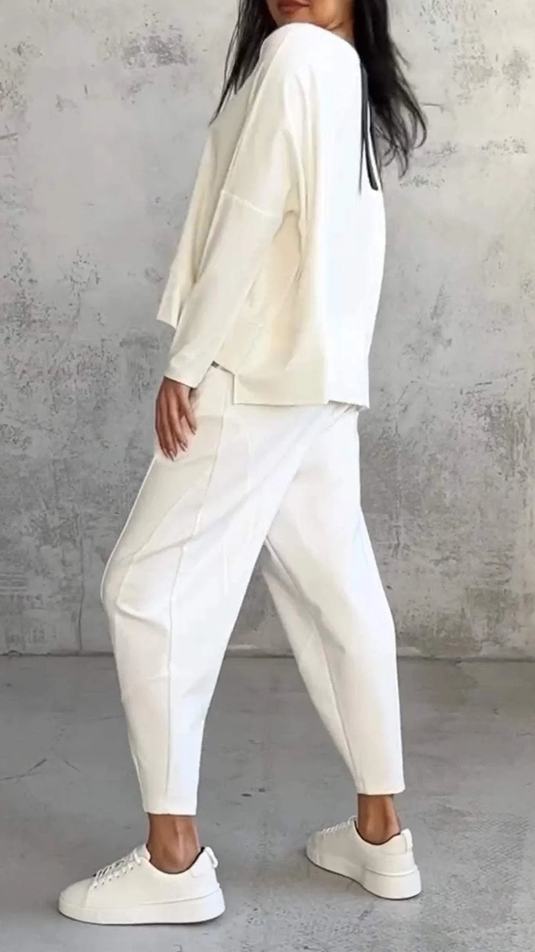 Women's knit 2-piece lounge set with long sleeve boat-neck top and tapered pants with pockets