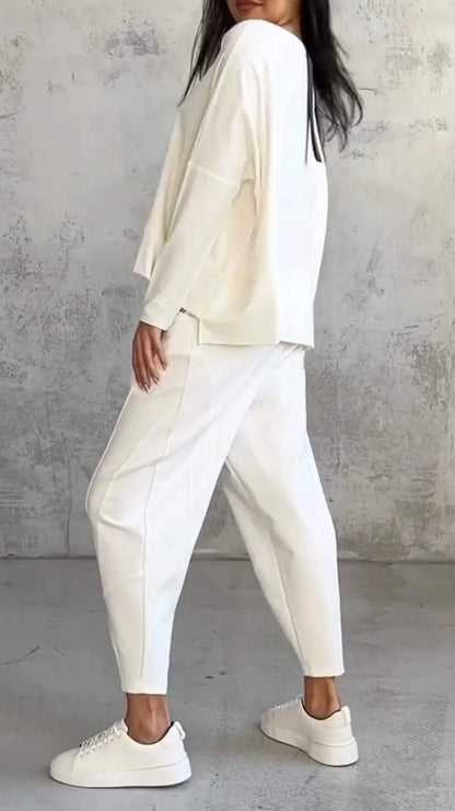 Women's knit 2-piece lounge set with long sleeve boat-neck top and tapered pants with pockets