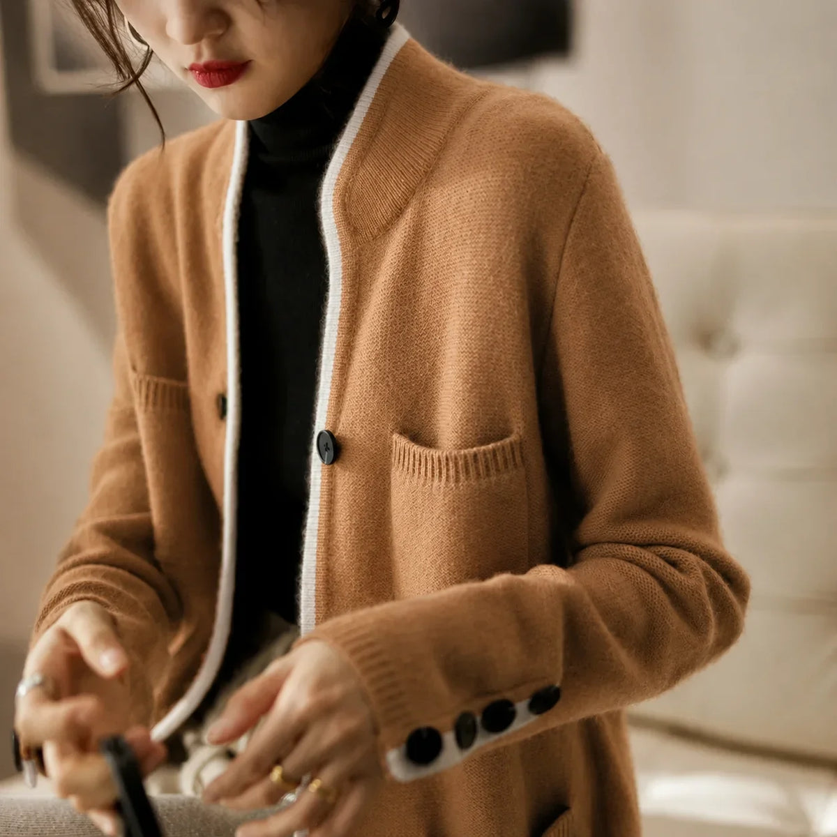 Women's knit button-front cardigan sweater with contrast trim and cuff buttons