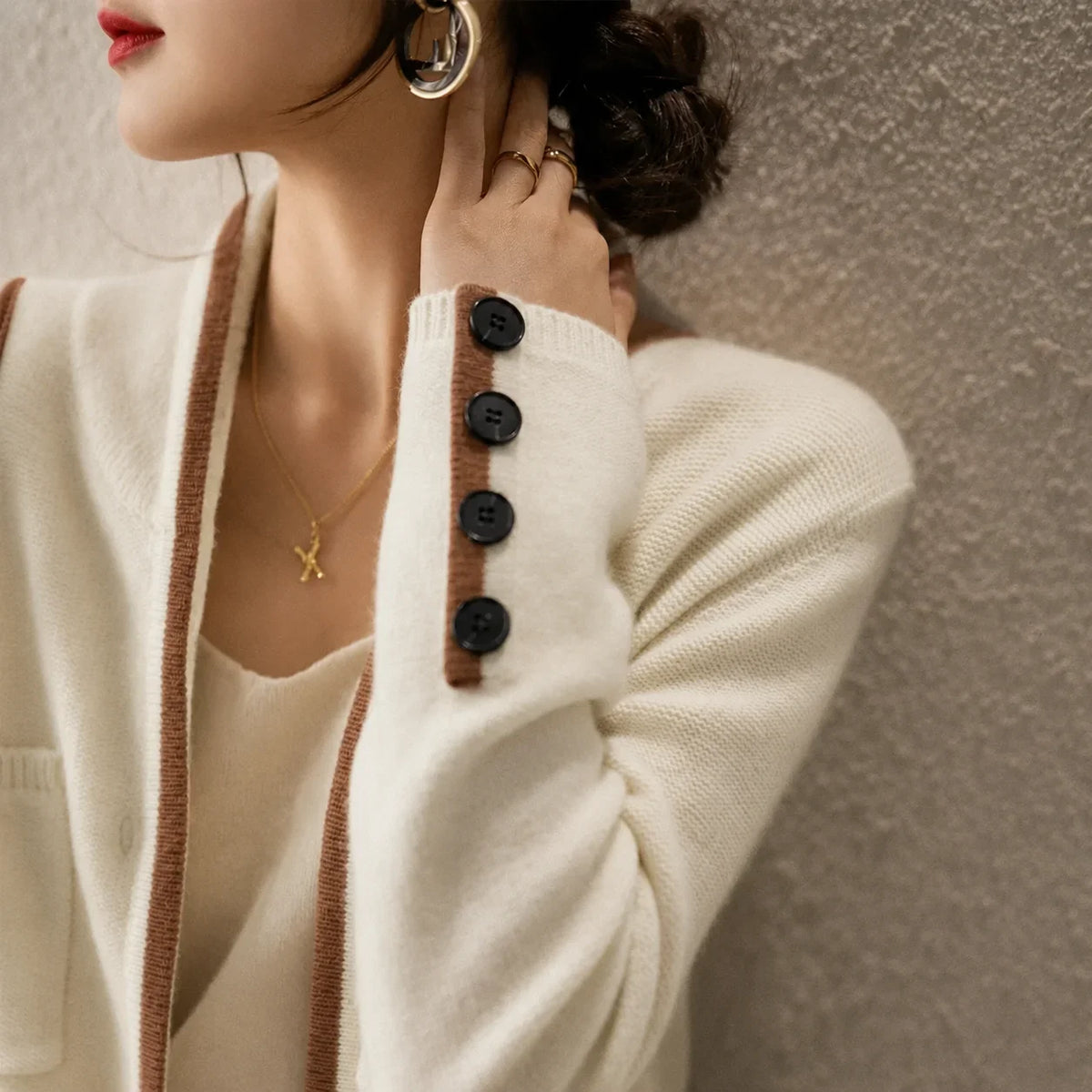 Women's knit button-front cardigan sweater with contrast trim and cuff buttons