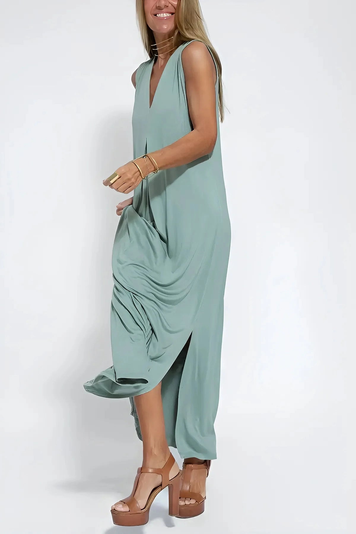Women's knit flowy maxi dress with sleeveless V-neck and draped front