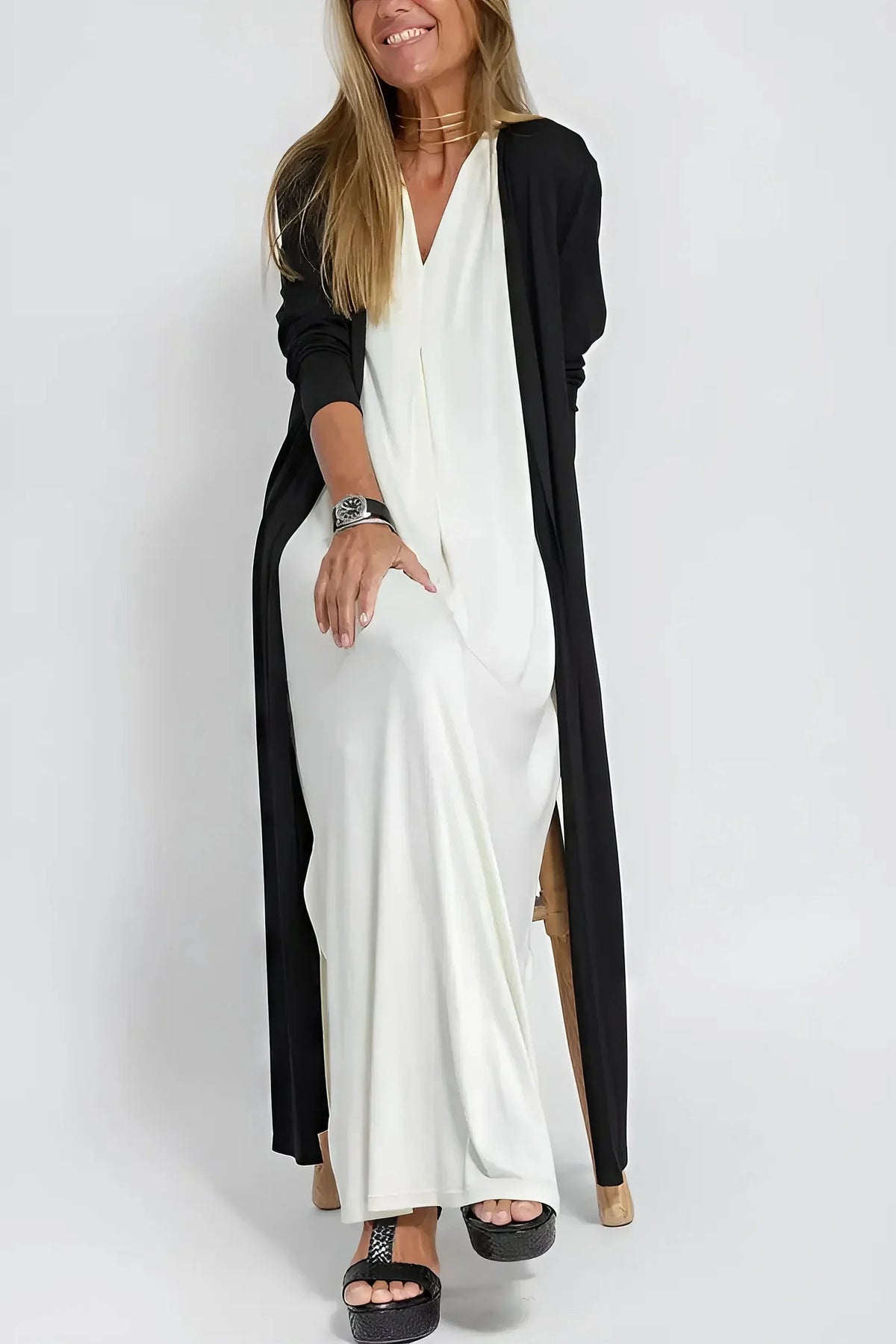 Women's knit flowy maxi dress with sleeveless V-neck and draped front