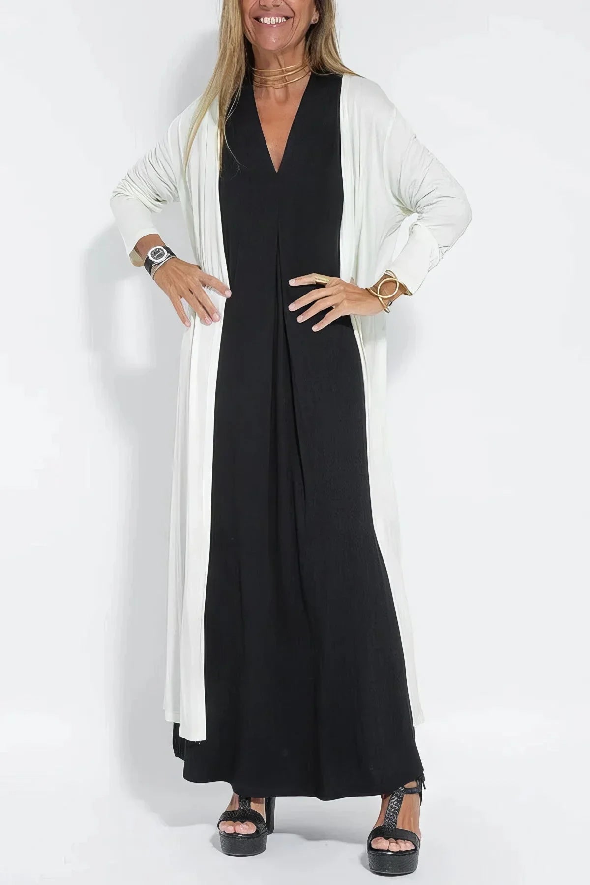 Women's knit flowy maxi dress with sleeveless V-neck and draped front