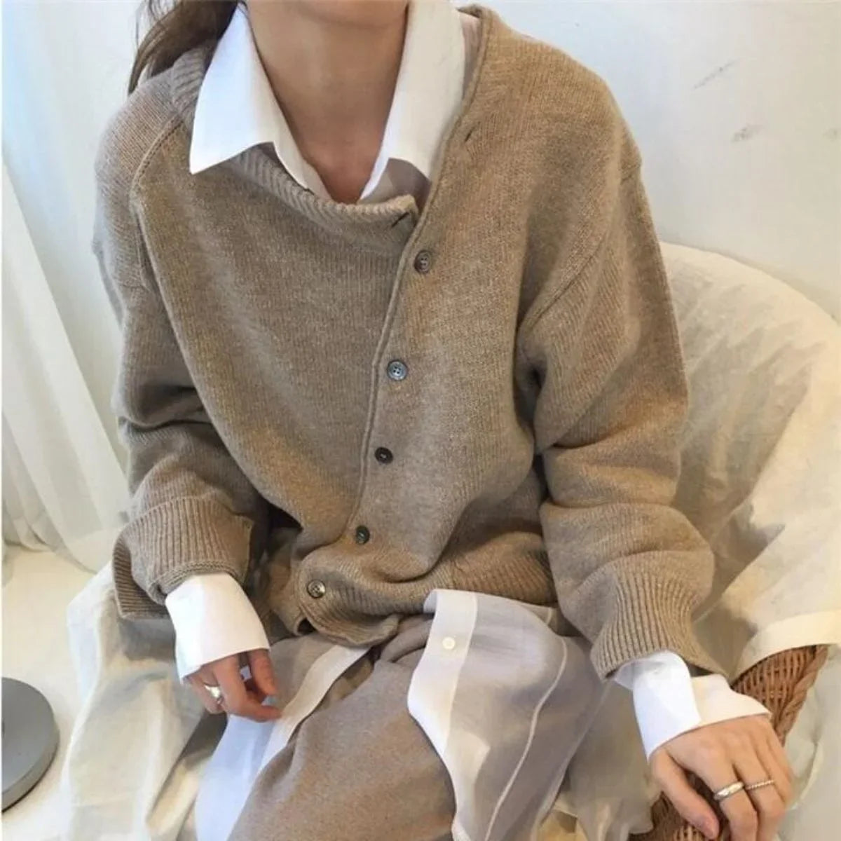 Women's knit loose-fit cardigan sweater with asymmetric button closure