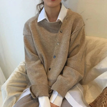 Women's knit loose-fit cardigan sweater with asymmetric button closure